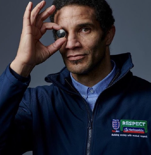 David James holding coin