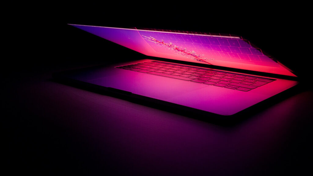 Laptop shining pink light