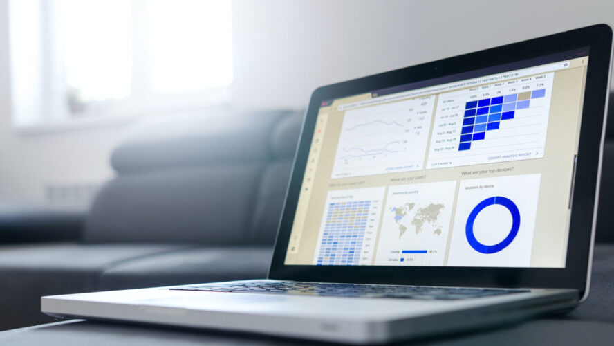 A laptop showing charts and graphs
