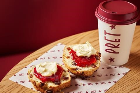 Two scones with jam and cream